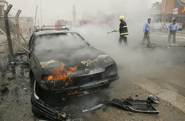 Twin bombs kill 27 at police station in Iraq