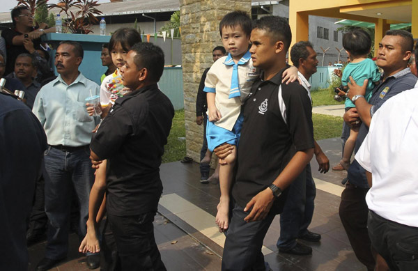 Malaysia police free 30 children held hostage