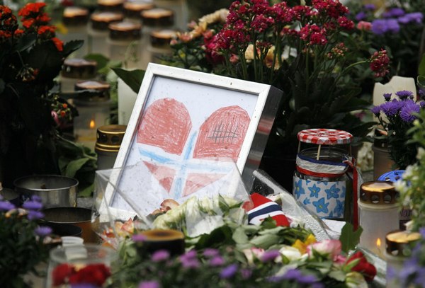 Sea of flowers marks vigil for twin attack victims