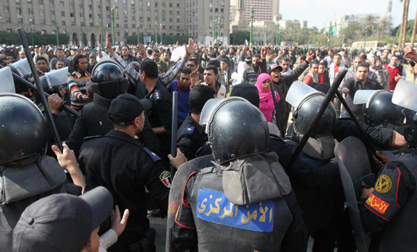 Egypt police, protesters clash over Tahrir square