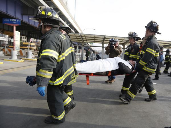 57 injured in NY ferry crash, 2 critical