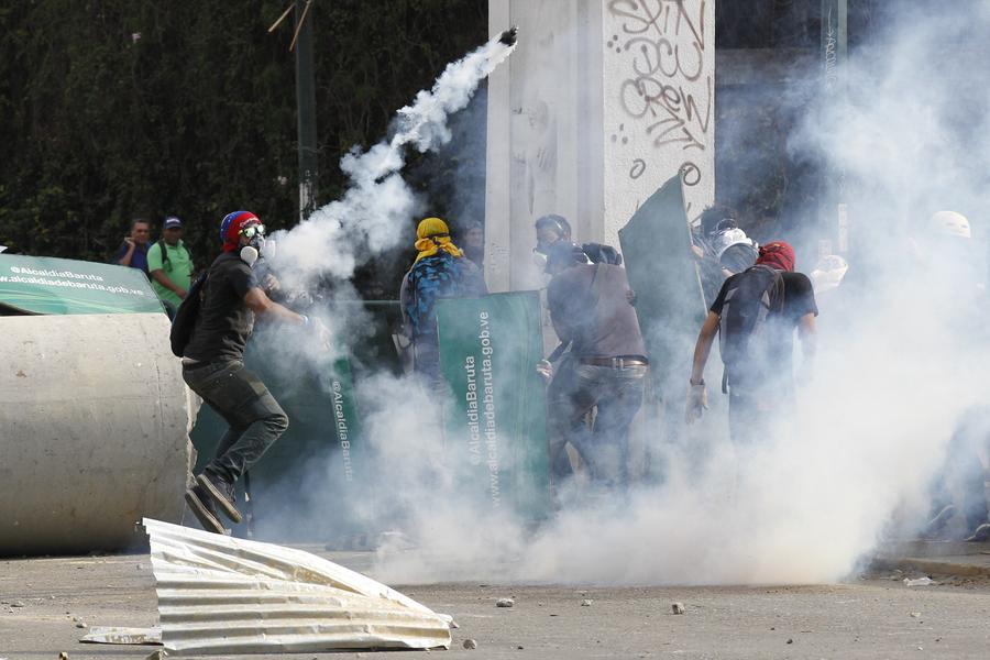 Venezuelan anti-govt protestors set on fire in rally