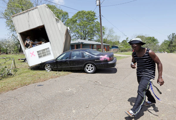 Death toll rises as storms tear through south US