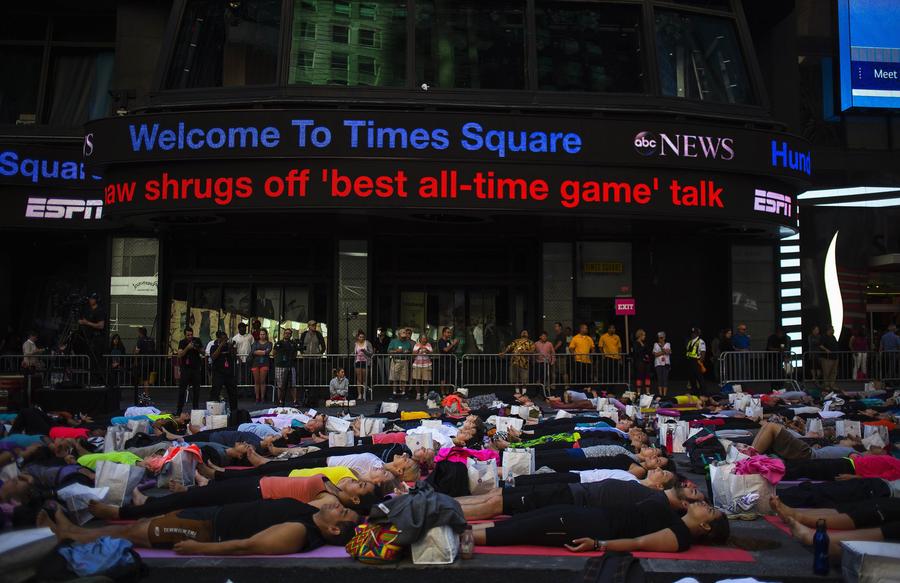 Thousands celebrate Summer Solstice with yoga in NY