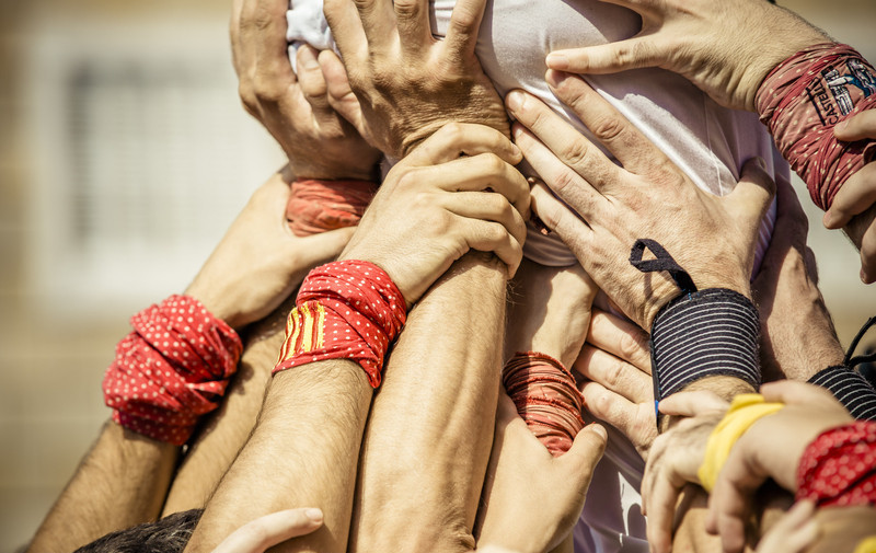 Castellers build human towers