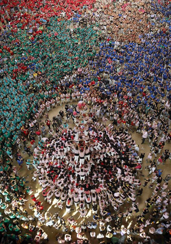 Castellers build human towers