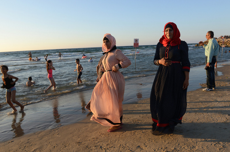 Palestinian Muslims enjoy Mediterranean Sea