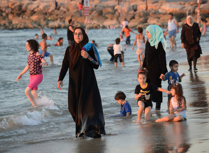 Palestinian Muslims enjoy Mediterranean Sea
