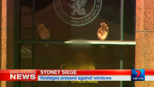 Police storm Sydney cafe to end hostage siege, three dead