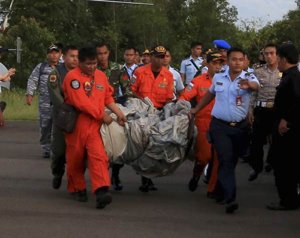 Divers set to search for AirAsia wreckage after debris, bodies found