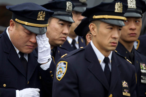 Thousands gather in NYC for funeral for slain police officer