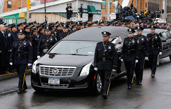 Thousands gather in NYC for funeral for slain police officer