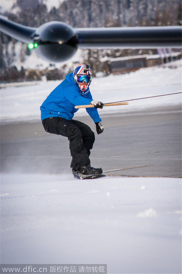 Snowboarder towed by a plane reaches speed of 78mph