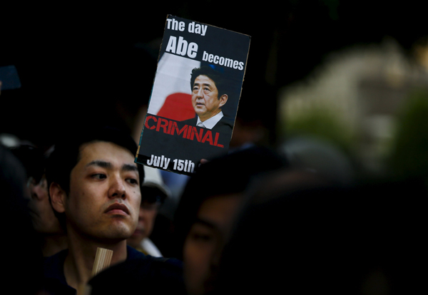 Abe gov't forcing war bills triggers anger