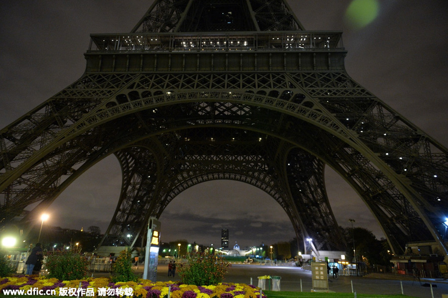 Eiffel Tower goes dark as France mourns terrorist attack victims