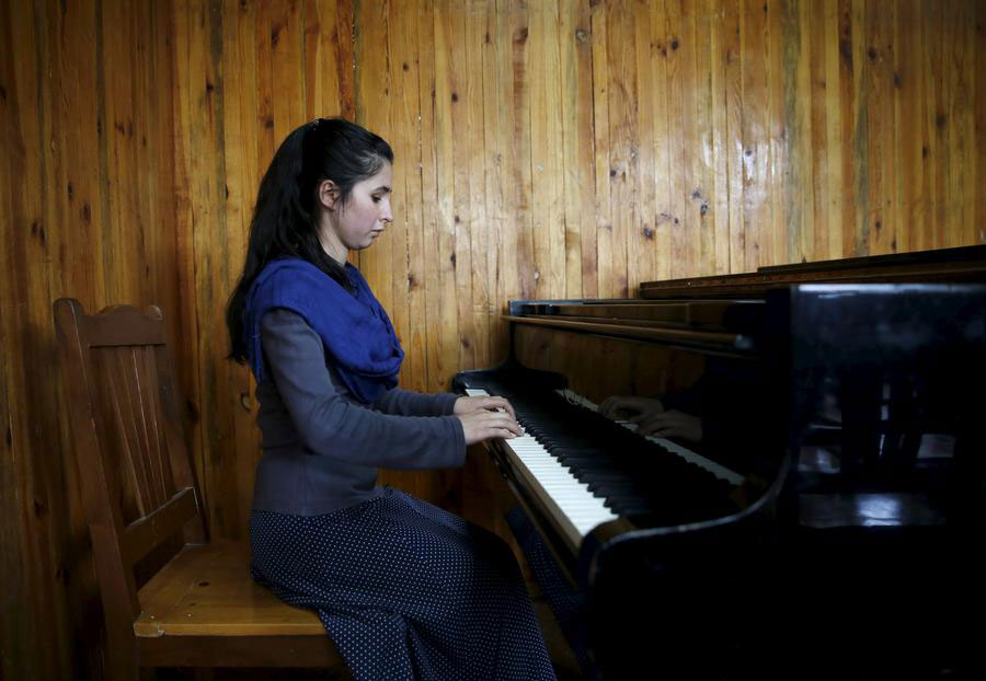 Afghan teenager braves threats to lead women's orchestra