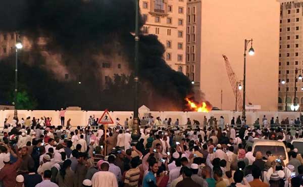 Suicide bombers hit three Saudi cities, killing at least four officers