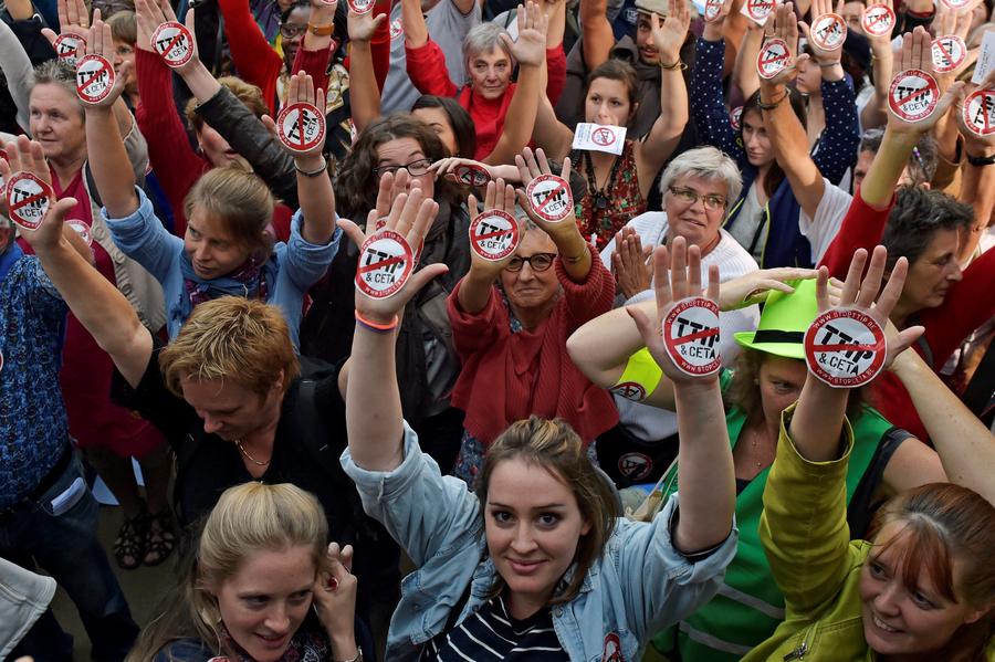 Thousands protesters march against EU trade deals with US, Canada