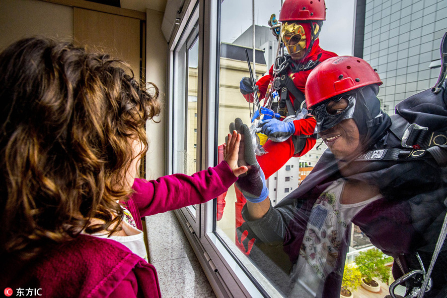 Superheroes make surprise visit to Brazil's children's hospital