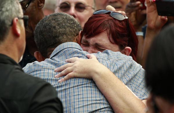 Obama touts record, attacks Romney on campaign bus tour
