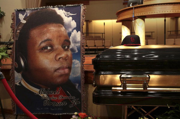 Mourners gather for funeral of slain black Missouri teen