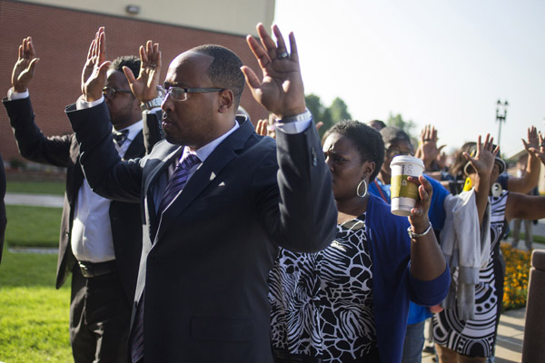 Mourners gather for funeral of slain black Missouri teen