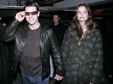 File photo shows actor Tom Cruise and his fiancee Katie Holmes walk to watch a show at the Shanghai Circus World November 28, 2005.