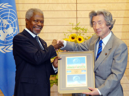 U.N. Secretary General Kofi Annan (L) shakes hands with Japanese Prime Minister Junichiro Koizumi as he is presented with a framed picture of a Japanese commemorative stamp marking the 50th years of Japan's association to the United Nations during their meeting at the prime minister's official residence in Tokyo, May 17, 2006. Annan flew from Seoul on Tuesday as part of his Asia tour. 