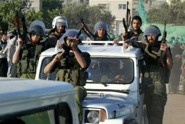 The new Hamas police march during a Hamas rally at the Nussirat camp in Gaza strip May 19, 2006. 