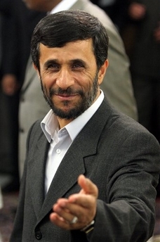 Iran's President Mahmoud Ahmadinejad gestures during a meeting with Senegalese President Abdoulaye Wade, unseen, in Tehran, on Tuseday June 27, 2006. [AP]