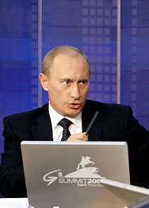 Russian President Vladimir Putin responds to questions put forward by internet users during a broadcast in Moscow's Kremlin July 6, 2006. 