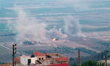 Smoke billows on the outskirts of the village of Qlaia, next to the town of Marjayoun, in southern Lebanon, Thursday, July 27, 2006, after an Israeli attack. Israeli warplanes renewed attacks on suspected Hezbollah targets in southern Lebanon on Friday, killing at least one person and wounding four others, Lebanese security officials said.