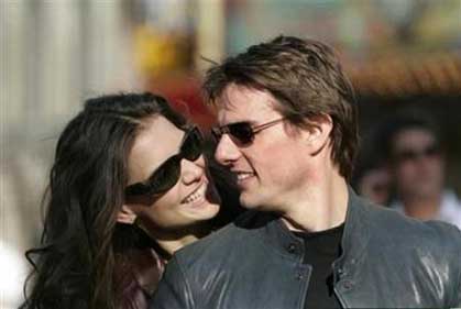 Tom Cruise and Katie Holmes in Hollywood, June 27, 2005. Cruise's infant daughter made her debut on Tuesday as freshman CBS anchor Katie Couric broke the story of Vanity Fair magazine landing the much-anticipated first photos of baby Suri. (Mario Anzuoni