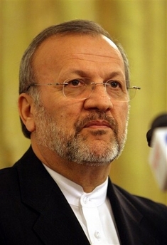 Iran's Foreign Minister Manoucher Mottaki attends a news conference in Tehran, Iran Wednesday Sept. 6, 2006. Mottaki said Wednesday that discussions were continuing to fix a date and venue for talks with the European Union over the disputed Iranian nuclear program. (AP 