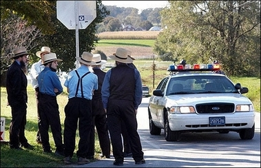 A group of Amish men stand near the scene of a shooting at a one room Amish schoolhouse in Nickel Mines, Pennsylvania. A truck driver with a grudge burst into a Amish schoolhouse in rural Pennsylvania and killed four girls 