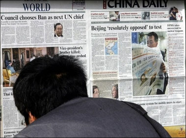 A Chinese man reads the China Daily on a bulletin board in Beijing. China's official media slammed North Korea over its declared nuclear test, saying the Stalinist regime's defiance would leave the international non-proliferation regime "in tatters," describing the announcement of a test as a "bombshell" and said that Pyongyang had defied the world.(AFP