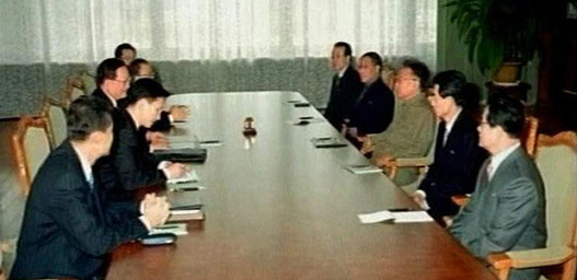 A video grab shows China's State Councillor and Former Foreign Minister Tang Jiaxuan (3rd from front L) speaking with North Korean leader Kim Jong-il (3rd R) in Pyongyang, North Korea, October 19, 2006. The United States said on Thursday it was open to negotiations with North Korea over its nuclear ambitions as attention focused on whether China had managed to persuade the North to defuse the mounting crisis. 