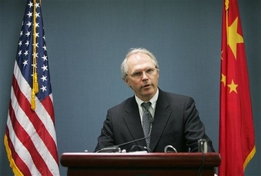 U.S. Assistant Secretary of State Christopher Hill speaks in front of the U.S. and Chinese flags at a press conference at the U.S. embassy in Beijing Tuesday Oct. 31, 2006. Hill said six-party talks on North Korea's nuclear program could resume as early as November or December. (AP