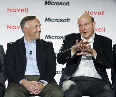 Microsoft CEO Steve Ballmer (R) talks as Novell President and CEO Ron Hovsepian watches during a news event to announce a set of collaboration agreements for Microsoft's Windows and Novell's Linux interoperability and support in San Francisco November 2, 2006. 