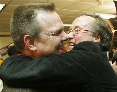 Democrat Jon Tester, left, and friend, Democratic Party activist, Joe Lamson, share a bear hug after Tester declared victory in his election battle for the Senate seat held by incumbent Republican Conrad Burns in Great Falls, Mont., Wednesday, Nov. 8, 2006. (AP