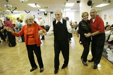 Connie Scolaro, 87, and Sal Buro, 92, left, and Frank, 80, and Sabine Mazzella, 79, dance during the social dancing program at the Amico senior citizen center Friday, Nov. 10, 2006 in the Brooklyn borough of New York. (AP 