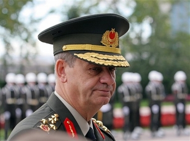 Turkey's Land Force Commander Gen. Ilker Bagbug waits outside his headquarters for a ceremony in Ankara in this Oct. 27, 2006 file photo. Turkey has suspended military relations with France in a dispute over whether the mass killings of Armenians in the last century amounted to genocide, Gen. Basbug said late Wednesday, Nov. 15, 2006. The move was the latest backlash against French legislation that, if approved by the French Senate and president, would criminalize denial that the World War I-era killings of Armenians in Turkey were genocide.(AP