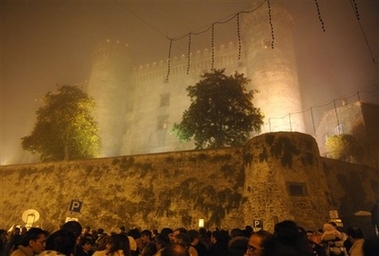 A night view of the 15th century Odescalchi Castle enveloped by fog, in the lakeside town of Bracciano some 43 kilometers (27 miles) from Rome, Saturday, Nov. 18, 2006. In a fairy-tale setting fit for royalty, U.S. actor Tom Cruise and U.S. actress Katie Holmes exchanged wedding vows Saturday evening in the 15th-century castle in central Italy. (AP 