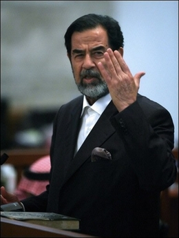 Ousted Iraqi dictator Saddam Hussein addresses the court during his trial held in Baghdad's heavily fortified Green Zone on November 8. Saddam's defence team has welcomed a report by US-based Human Rights Watch that denounced his trial for crimes against humanity as fundamentally flawed, and called for international action to end the 