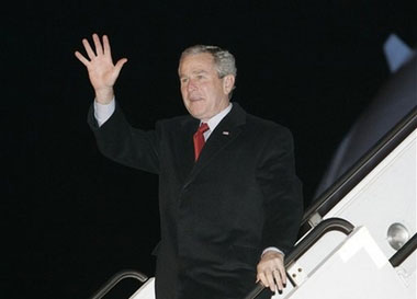 President George W. Bush waves upon his arrival at Tallinn Ulemiste Airport, Monday, Nov. 27, 2006 in Tallinn, Estonia. George W. Bush became the first U.S. president to visit Estonia when he arrived in the Baltic nation late Monday on a brief stopover seen as a token of American gratitude for the tiny ally's unwavering support in the war on terror. (AP