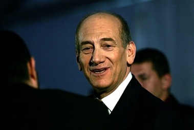 Israeli Prime Minister Ehud Olmert arrives to a conference in the southern town of Kiryat Malachi Tuesday Dec. 5, 2006. (AP