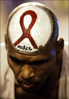 A man is seen with an AIDS awareness message painted on his head in January 2006. Circumcision significantly reduces the risk of contracting the AIDS virus, according to two new studies released and that could have significant implications in the fight against the deadly disease.(AFP