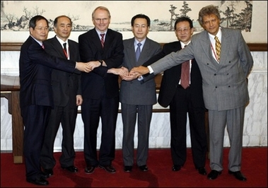 Top envoys join hands in Beijing before a dinner on the eve of the resumption of Six-Party talks aimed at dismantling North Korea's nuclear program. The talks, which involve the two Koreas, host China, the United States, Japan and Russia, started in 2003 in an effort to stop the DPRK acquiring nuclear weapons. From left to right are: South Korea's Chung Yung-Woo; Japan's Kenichiro Sasae; USA's Christopher Hill; China's Wu Dawei; North Korea's Kim Kye-Gwan; and Russia's Sergey Razov.(AFP