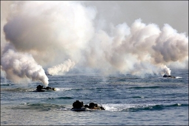 North Korean soldiers look at the photographer on the bank of the Yalu River near the North Korean town of Sinuiju December 18, 2006. 