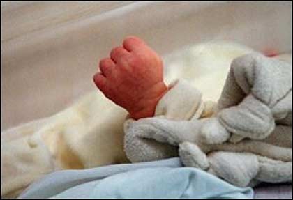 The hand of a newborn baby. A British mother could get into the record books after she gave birth to twins and a single baby at the same time -- from two wombs -- in what is believed to be a world first.(AFP